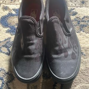 blacked out flame slip on vans